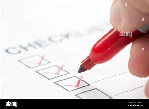 Hand With Red Marker Pen Marking On Checklist Box Stock Photo Alamy