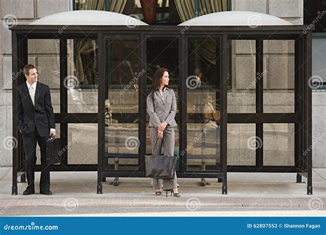 People waiting at bus stop stock image. Image of communication - 62807553