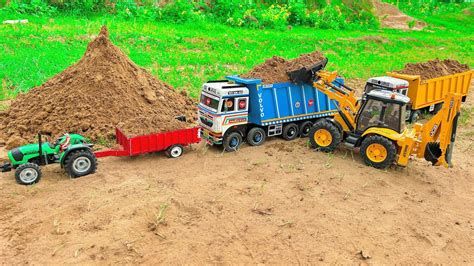 Jcb Cx Backhoe Loading Mud In Tata Truck And Tata Tipper Truck