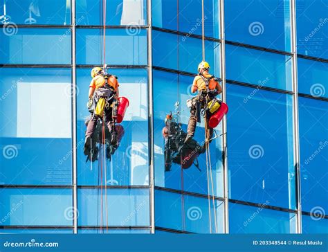 Washers Wash The Windows Of Modern Skyscraper Window Cleaner Working