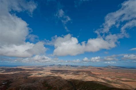 Premium Photo Aerial View Of Arid Landscape Against Cloudy Sky