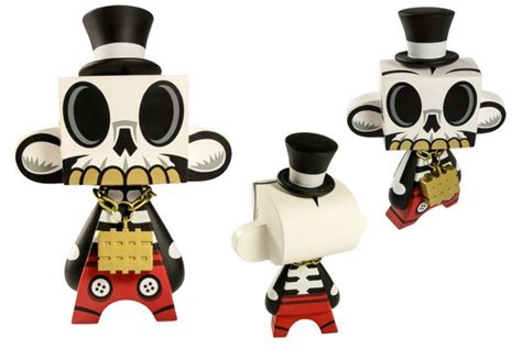 Two Toy Figurines Made To Look Like They Are Dressed Up As Skeleton