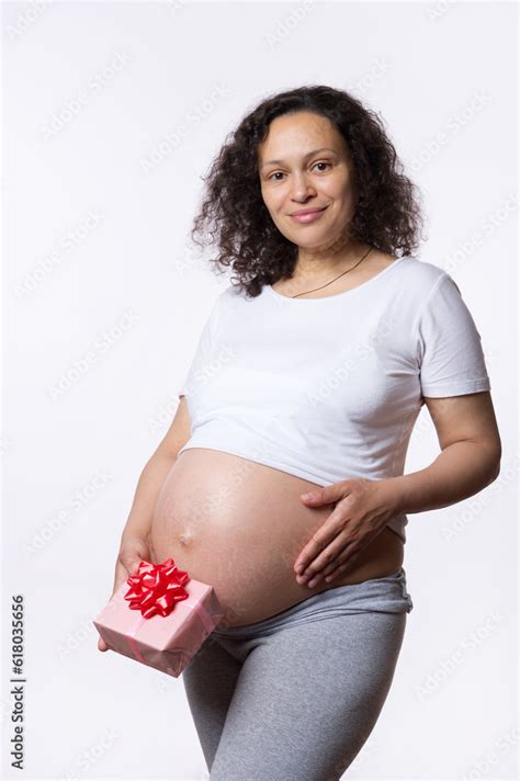 Attractive Positive Multi Ethnic Pregnant Woman Holding A T Box