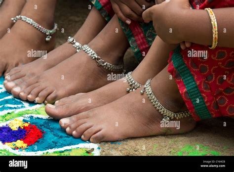 Indian Girls Bare Feet Around A Indian Rangoli Peacock Festival Design