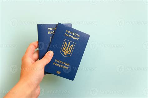 Two Ukrainian Biometric Passports In A Female Hand 36037852 Stock