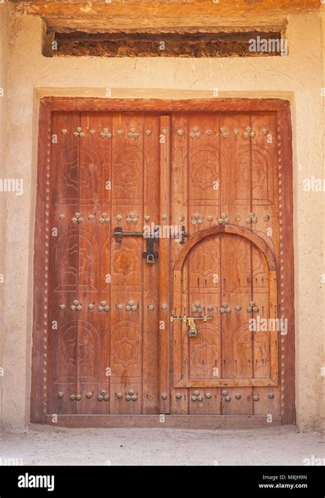 A Traditional Arabian Door Within A Door In A Building In In Al Ain