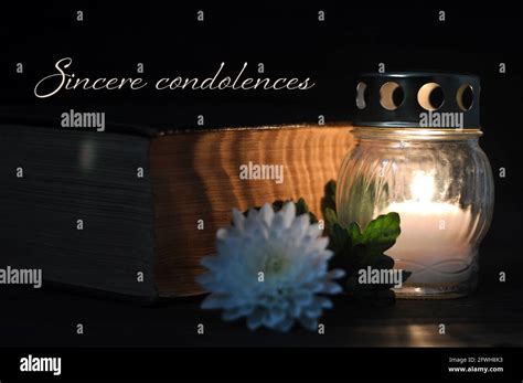 Condolence card with white burning candle and flower Stock Photo - Alamy