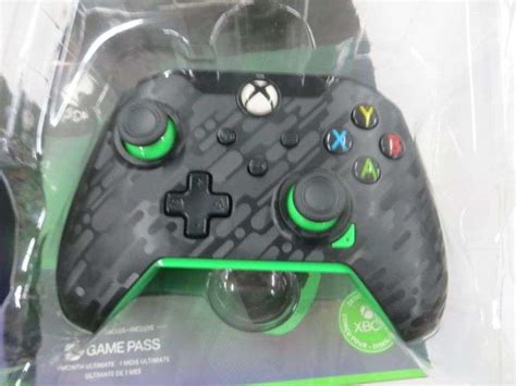 2 XBOX PDP Neon Carbon Paddles See Details - Lambrecht Auction, Inc.