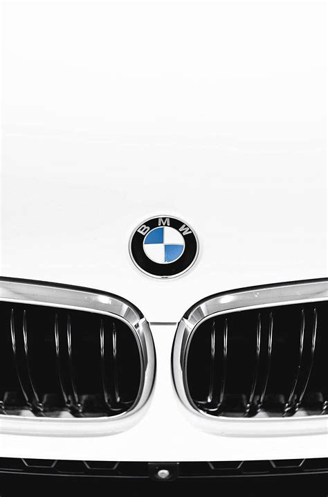 Download BMW Luxury Car Hood Portrait Wallpaper | Wallpapers.com