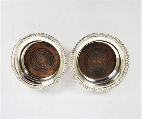 Pair Of Antique English Silver Plated Bottle Coasters With Turned