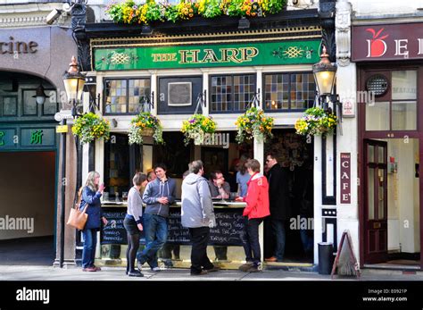 People Drinking Outside The Harp Pub Covent Garden London England