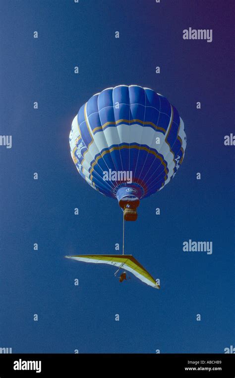 Hot Air Balloon With Hang Glider Stock Photo Alamy
