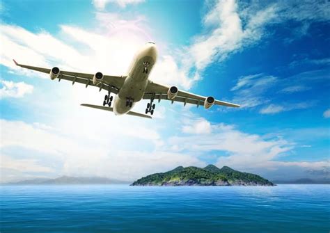 Passenger Plane Flying Over Beautiful Blue Ocean And Island In P