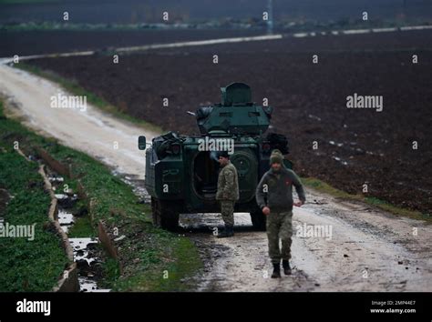 Turkish Soldiers On An Armoured Personnel Carrier Secure A Staging Area