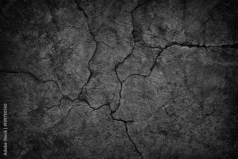 Cracked Concrete Wall Covered With Black Cement Texture As Background