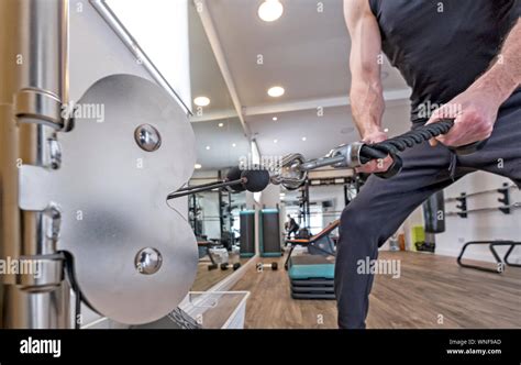 Fitness studio and gym with equipment Stock Photo - Alamy