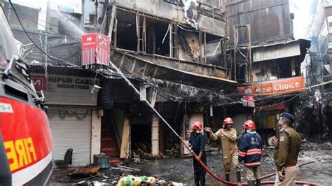 Bhagirath Palace Fire Two Buildings Fall After Blaze Narrow Lanes Hit