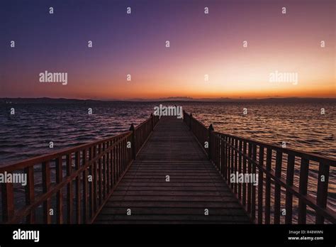 Sunset Over A Wooden Pier At Paracas National Reserve Stock Photo Alamy