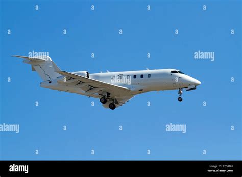 Private jet on landing approach with landing gear down Stock Photo - Alamy