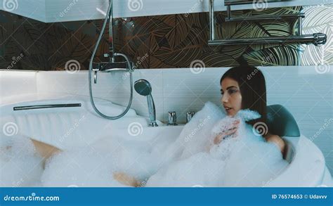 Brunette Young Girl Taking Bath Full Foam Bathroom Blow Bubbles Foam