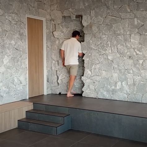 Stone wall doubles as a hidden secret passage [Video]