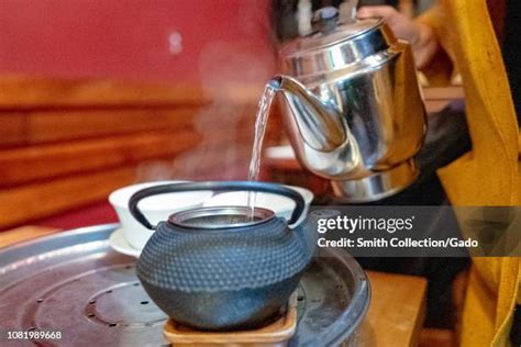 Woman Pouring Boiling Water Photos And Premium High Res Pictures