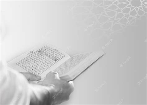 Premium Photo A Person Reading A Holy Quran In Black And White