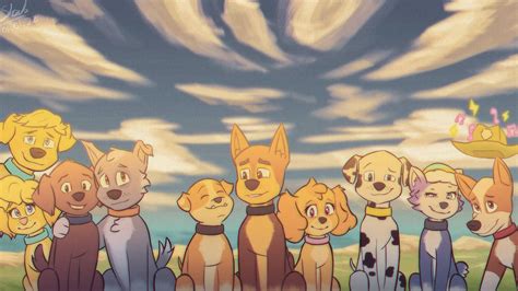 a group of dogs standing next to each other in front of a sky with clouds