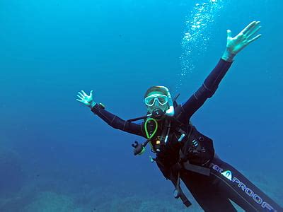 Royalty Free Photo Man Wearing Black And Red Diving Suit Underwater