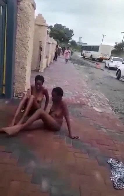 Two Naked Ebony Allegedly Mad Women Caught Lying In Front Of A Building