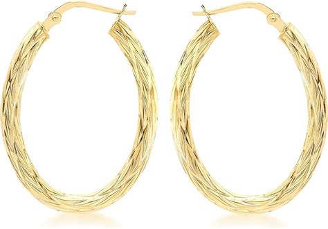 Carissima Gold Women S Ct Yellow Gold Oval Patterned Creole Earrings