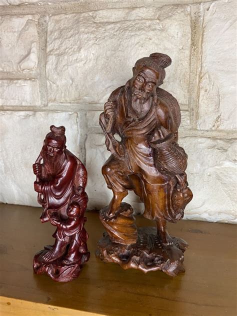 Lot 198 Two Carved Wooden Asian Figurines Slocal Estate Auctions Network