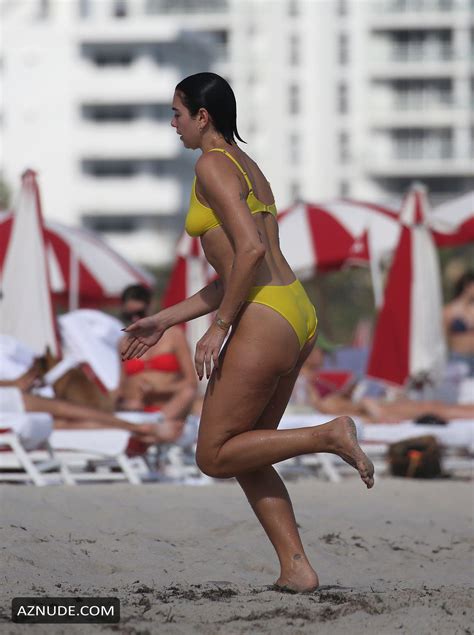 Dua Lipa Sexy In Yellow Bikini As She Takes Dip In The Ocean With Her SisterRina In Miami AZNude
