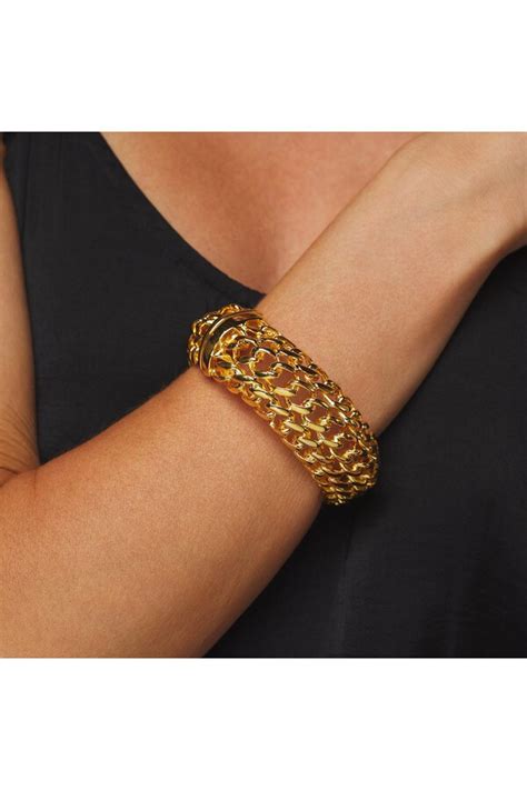 KENNETH JAY LANE Wide Polished Gold Braided Bracelet Editorialist