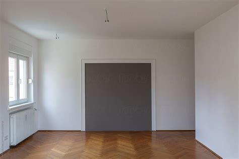 "Empty Living Room With Fresh Painted Walls And Hardwood Floor" by ...