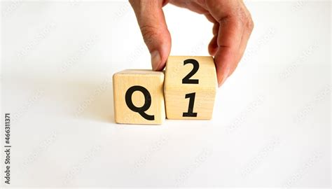 From 1st To 2nd Quarter Symbol Businessman Turns A Wooden Cube And