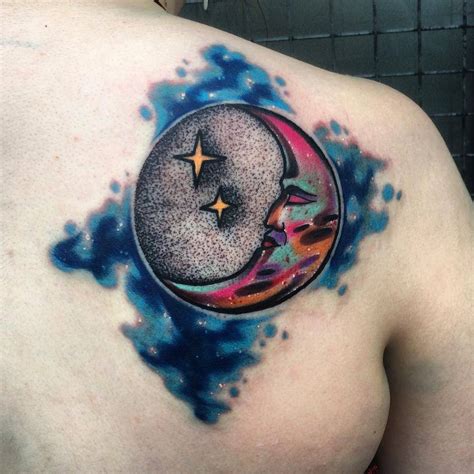 Abstract/psychedelic moon tattoo on the shoulder blade.