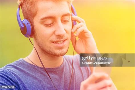 113 Man Lying On Ground Wearing Headphones Eyes Closed Stock Photos