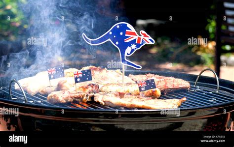 Iconic Australian BBQ Close Up Of Man Cooking Chops Sausgaes And Steak