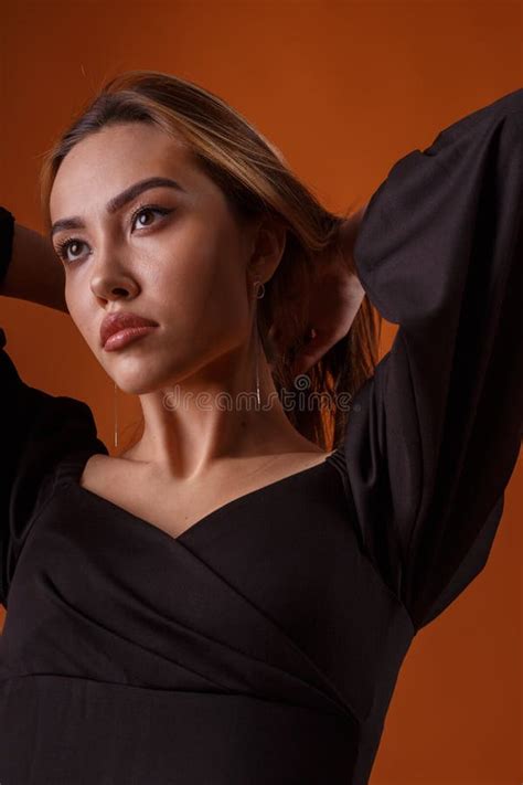 Elegant Fashion Model Wearing Black Dress Deep Neckline Stock Photos