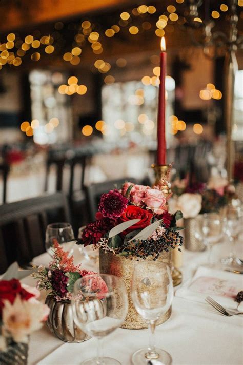 The Table Is Set With Candles Flowers And Wine Glasses For An Elegant