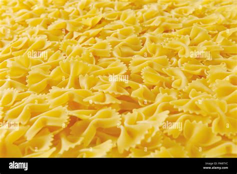 Background Of Uncooked Bow Tie Pasta Stock Photo Alamy