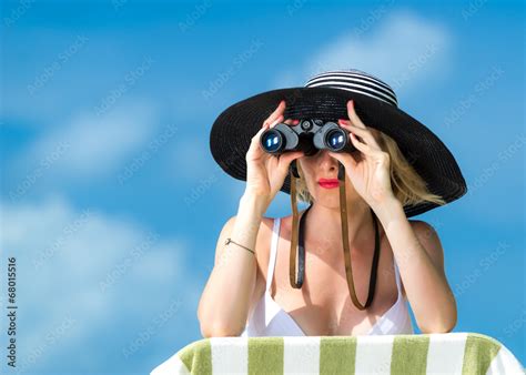 Beautiful Woman In Bikini Looking Through Binoculars Stock Photo Adobe Stock