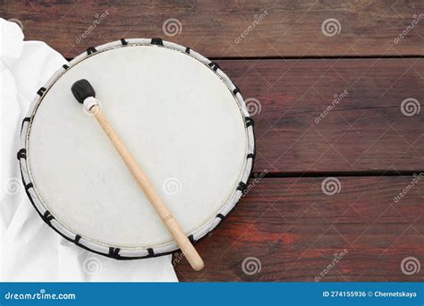 modern drum  drumstick  wooden table top view space  text