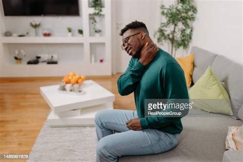 Black Man Neck Pain Photos And Premium High Res Pictures Getty Images