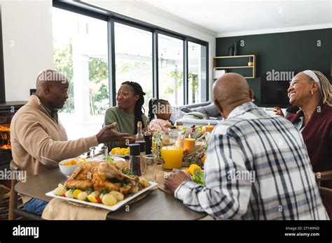 African american parents, children and grandparents celebrating at ...