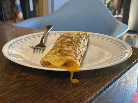 Whoops, a little cheese escaped (hash and cheddar omelette) : r