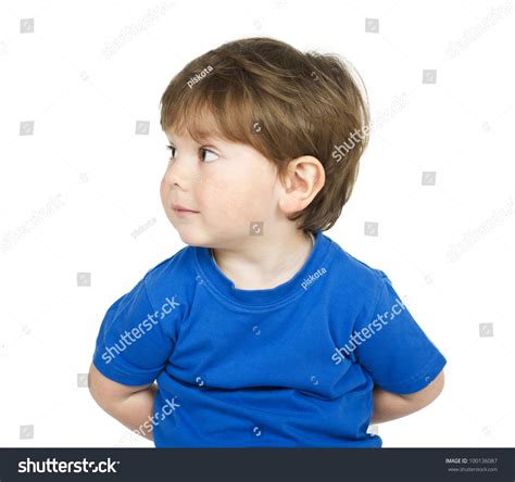 Cute Boy Hiding Something Behind Itself Isolated On White Stock Photo