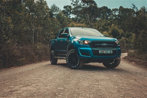 Blue Ford Ranger on Dirt Road · Free Stock Photo