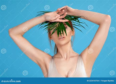 Blonde Woman Hiding Behind Palm Tropical Leaves Stock Photo Image Of